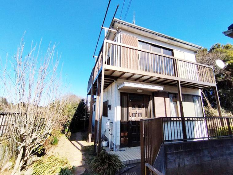 This three-year-old, two-story wooden house sits on a spacious 180