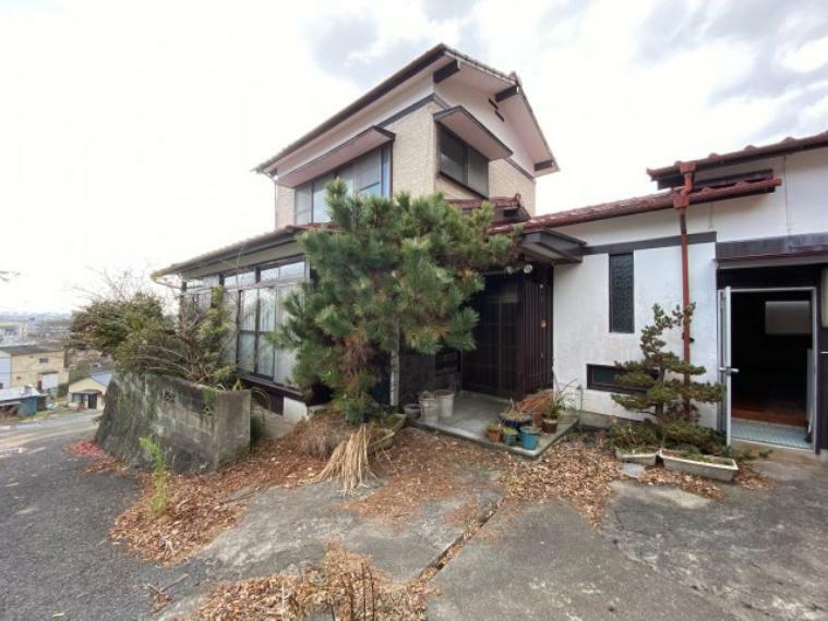 This 53-year-old, 2-story, wood-frame house is situated on a large lot in a quiet residential area